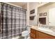 Well-appointed bathroom with granite countertop, wood cabinets, and shower/tub combo at 10330 W Desert Forest Cir, Sun City, AZ 85351