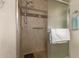 Clean and modern bathroom featuring a walk-in shower with safety bar at 10330 W Desert Forest Cir, Sun City, AZ 85351