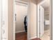 Walk-in closet with hanging clothes and shelves at 10330 W Desert Forest Cir, Sun City, AZ 85351
