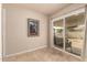 Sunroom with sliding glass doors and tile flooring, leading to backyard at 10330 W Desert Forest Cir, Sun City, AZ 85351
