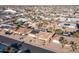 Aerial view of single-level home with solar panels and desert landscaping at 12422 W Ginger Dr, Sun City West, AZ 85375