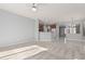 Living room with carpet, neutral walls, kitchen island view at 13137 W Stella Ln, Litchfield Park, AZ 85340