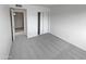 Empty bedroom with sliding door closet and gray carpet at 1433 N 53Rd Ave, Phoenix, AZ 85043