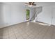 Living room with tile flooring, a ceiling fan, stairs, and a window at 1433 N 53Rd Ave, Phoenix, AZ 85043