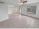 Bright living room with tile floors, ceiling fan, door and windows at 1433 N 53Rd Ave, Phoenix, AZ 85043