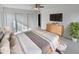 Spacious main bedroom with large TV and ample closet space at 1433 N 53Rd Ave, Phoenix, AZ 85043