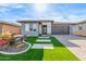 Modern single-story home with a landscaped front yard and paved driveway at 17733 E Bear Wallow Way, Rio Verde, AZ 85263