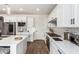 White kitchen with stainless steel appliances, ample counter space, and gas range at 17733 E Bear Wallow Way, Rio Verde, AZ 85263