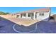 Landscaped backyard with a covered patio at 19776 N Harris N Dr, Maricopa, AZ 85138