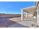 Covered patio and spacious backyard with gravel at 19776 N Harris N Dr, Maricopa, AZ 85138