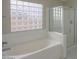 Clean bathroom with bathtub and shower at 19776 N Harris N Dr, Maricopa, AZ 85138