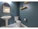 Powder room with pedestal sink and teal walls at 19776 N Harris N Dr, Maricopa, AZ 85138