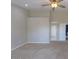 Spacious bedroom with ceiling fan and neutral walls at 19776 N Harris N Dr, Maricopa, AZ 85138