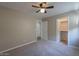 Spacious bedroom with carpeted floor and walk-in closet at 19776 N Harris N Dr, Maricopa, AZ 85138