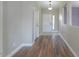 A hallway with wood flooring and neutral color scheme at 19776 N Harris N Dr, Maricopa, AZ 85138