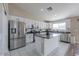 Spacious kitchen with island, stainless steel appliances, and white cabinets at 19776 N Harris N Dr, Maricopa, AZ 85138