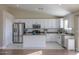 Modern kitchen with stainless steel appliances and an island at 19776 N Harris N Dr, Maricopa, AZ 85138