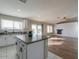 Bright kitchen with island, hardwood floors, and open layout to living area at 19776 N Harris N Dr, Maricopa, AZ 85138