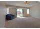Living room with sliding door to backyard at 19776 N Harris N Dr, Maricopa, AZ 85138