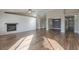 Living room with hardwood floors, fireplace and open floor plan at 19776 N Harris N Dr, Maricopa, AZ 85138
