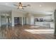 Open concept living area with hardwood floors and kitchen view at 19776 N Harris N Dr, Maricopa, AZ 85138