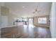 Open living space with hardwood floors, high ceilings, and a kitchen at 19776 N Harris N Dr, Maricopa, AZ 85138