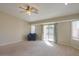 Bright living room featuring sliding glass doors and comfy seating at 19776 N Harris N Dr, Maricopa, AZ 85138