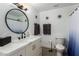 Clean and modern bathroom with a marble countertop vanity and stylish fixtures at 2041 E Harvard Dr, Tempe, AZ 85283
