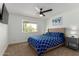 Inviting bedroom with a queen-size bed, a ceiling fan, and ample natural light at 2041 E Harvard Dr, Tempe, AZ 85283