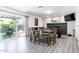 Dining and entertainment area with a fireplace, sliding glass doors, and access to the backyard at 2041 E Harvard Dr, Tempe, AZ 85283