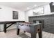 Game room featuring a foosball table, shuffleboard, and a brick fireplace at 2041 E Harvard Dr, Tempe, AZ 85283