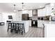 Stylish kitchen with white cabinetry, stainless steel appliances, and an island with bar stools at 2041 E Harvard Dr, Tempe, AZ 85283