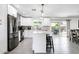 Modern kitchen featuring white cabinets, stainless steel appliances, and an island with seating at 2041 E Harvard Dr, Tempe, AZ 85283