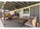 Covered patio features comfortable seating, dining area, and pool access at 2041 E Harvard Dr, Tempe, AZ 85283