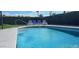 Sparkling pool with lounge chairs and lush landscaping at 2041 E Harvard Dr, Tempe, AZ 85283
