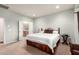 Spacious bedroom with ensuite bathroom, plush carpeting, and ample space at 21425 N 262Nd Dr, Buckeye, AZ 85396