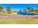 Scenic golf course with a tranquil water feature at 26201 S Sherbrook Dr, Sun Lakes, AZ 85248