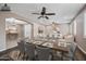 Open-concept living room and dining area with stylish ceiling fans and elegant decor at 2872 E Redwood Pl, Chandler, AZ 85286