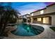 Backyard with pool, spa, covered patio, and lush landscaping at 2872 E Redwood Pl, Chandler, AZ 85286