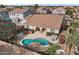 Inviting backyard oasis featuring a sparkling pool, built-in grill, and lush landscaping at 2981 E Fandango Dr, Gilbert, AZ 85298