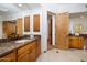 Spacious bathroom with double vanity, wood cabinets, and marble countertops at 33296 N Vanishing Trl, Scottsdale, AZ 85266