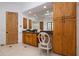 Large bathroom with vanity, wood cabinetry, and tile flooring at 33296 N Vanishing Trl, Scottsdale, AZ 85266