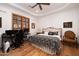 Bedroom with king-size bed, desk, and sitting area at 33296 N Vanishing Trl, Scottsdale, AZ 85266