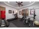 Home gym with treadmill, weights, and punching bag at 33296 N Vanishing Trl, Scottsdale, AZ 85266