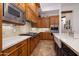 Kitchen showcasing custom wood cabinets, farmhouse sink, and stainless steel appliances at 33296 N Vanishing Trl, Scottsdale, AZ 85266