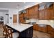 Kitchen with wood cabinets, stainless steel appliances, and large island at 33296 N Vanishing Trl, Scottsdale, AZ 85266