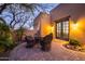 Charming patio with a dining set and lush greenery at 33296 N Vanishing Trl, Scottsdale, AZ 85266