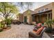 Exterior view of a home's patio with seating and desert landscaping at 33296 N Vanishing Trl, Scottsdale, AZ 85266