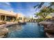 Resort-style pool with waterfall feature and attached spa at 33296 N Vanishing Trl, Scottsdale, AZ 85266