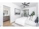 Main bedroom featuring ensuite bathroom, wood-style flooring, and large window with city views at 4220 N 32Nd St # 30, Phoenix, AZ 85018